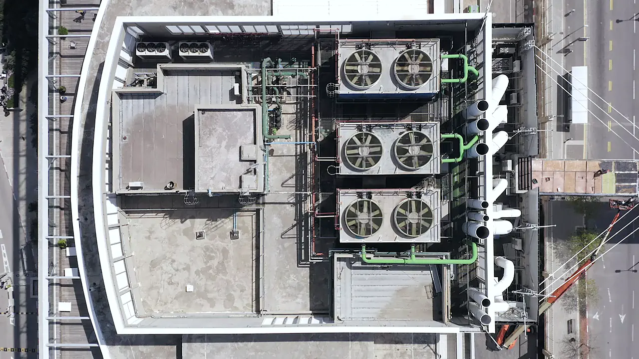 Aerial view of HVAC condenser units on a commercial building roof